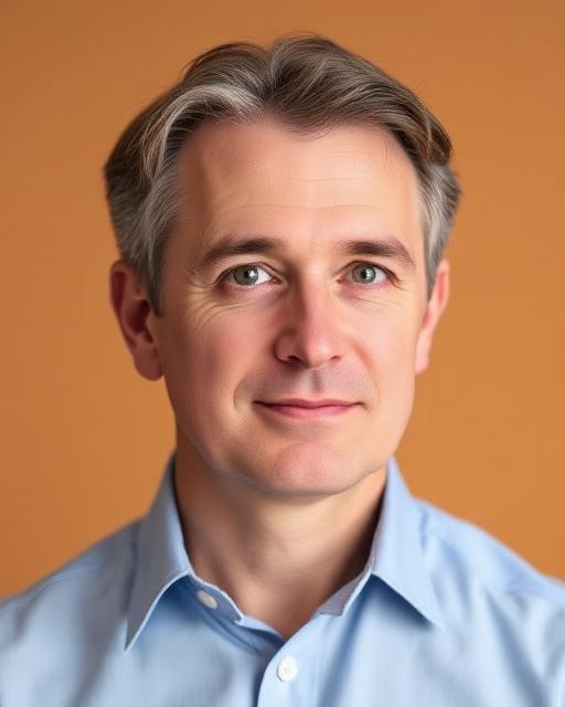 Professional portrait of James Holloway, man in his 40s with grey-flecked brown hair, light blue shirt, thoughtful expression against a warm-toned background